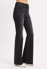 Black flared jeans on a white background
