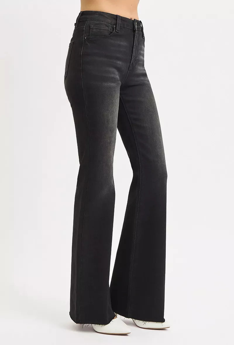 Black flared jeans on a white background