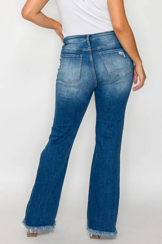 Blue jeans worn by a person on a white background