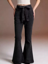 Black bell-bottom pants with a tie waist on a neutral background