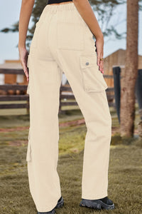 Beige cargo pants worn by a person outdoors with a blurred background