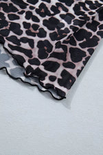 Leopard print fabric on a light gray background