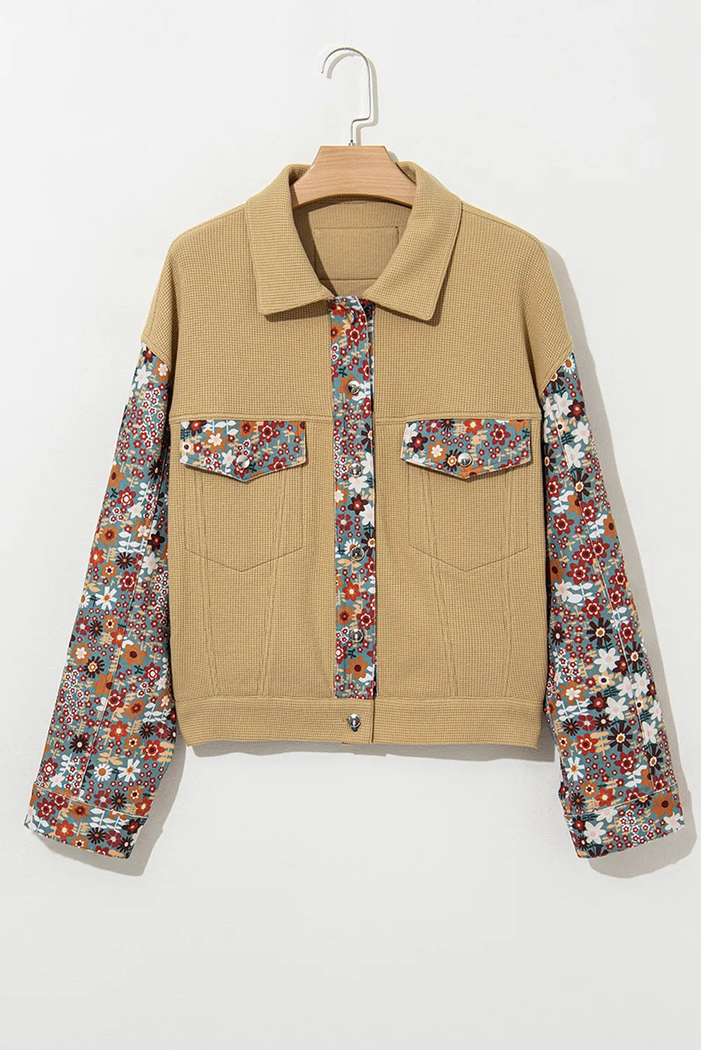 Beige jacket with floral sleeves on a white background
