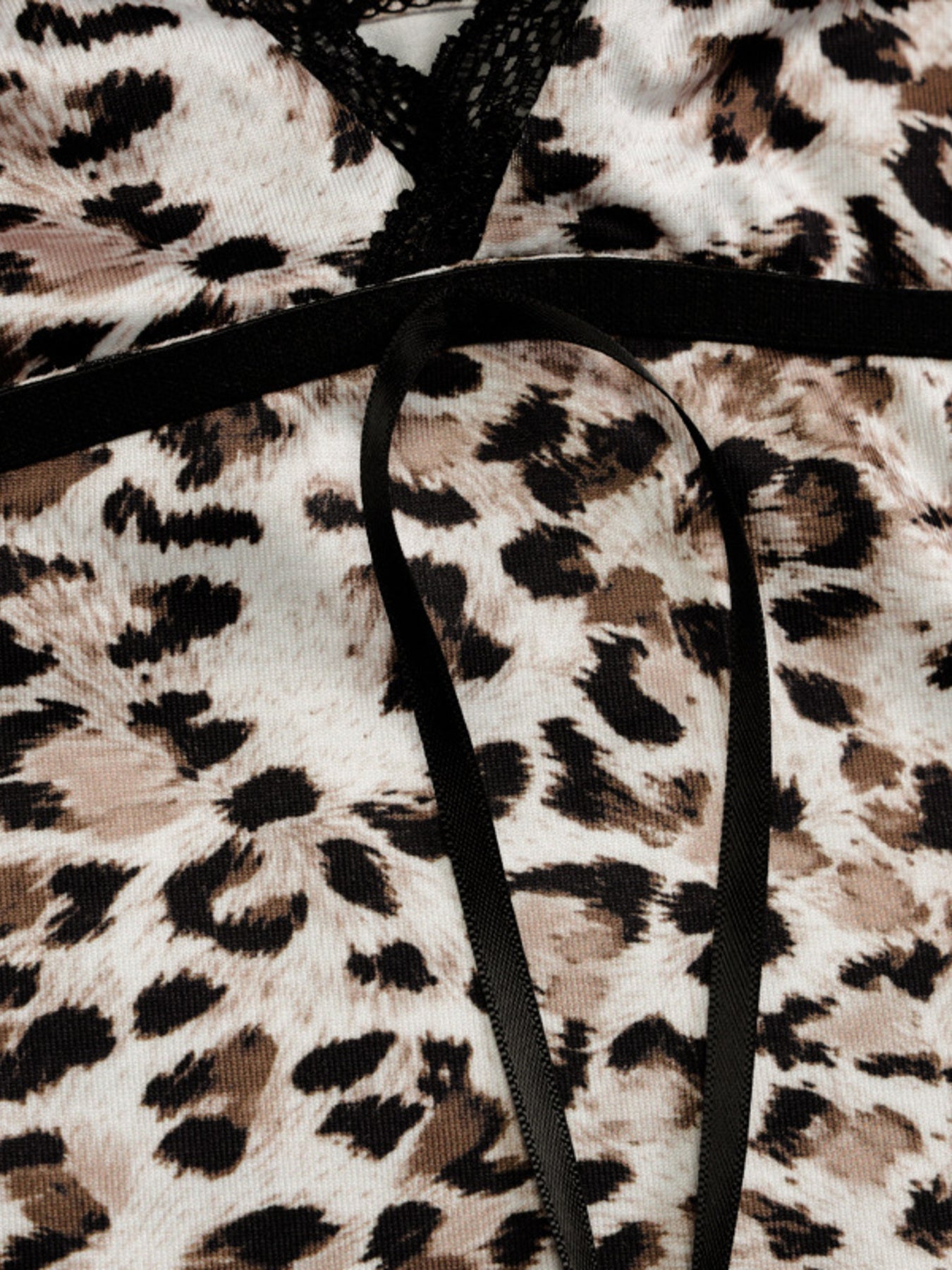 Leopard print fabric with a black hanger on top