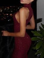 Woman wearing a burgundy sparkly dress with a nighttime cityscape background