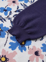 Navy blue fabric on a floral-patterned surface