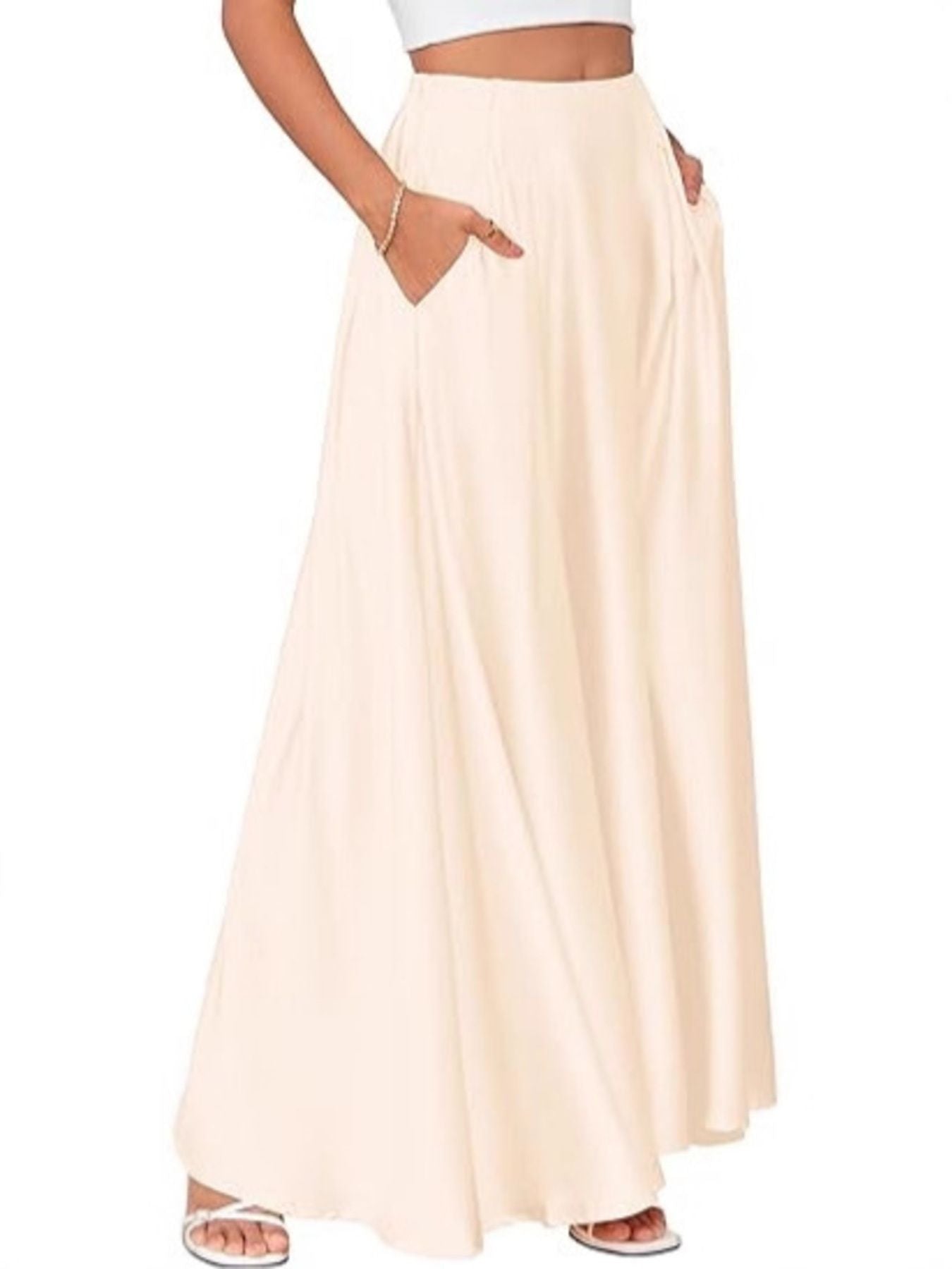 Beige maxi skirt worn by a person on a white background