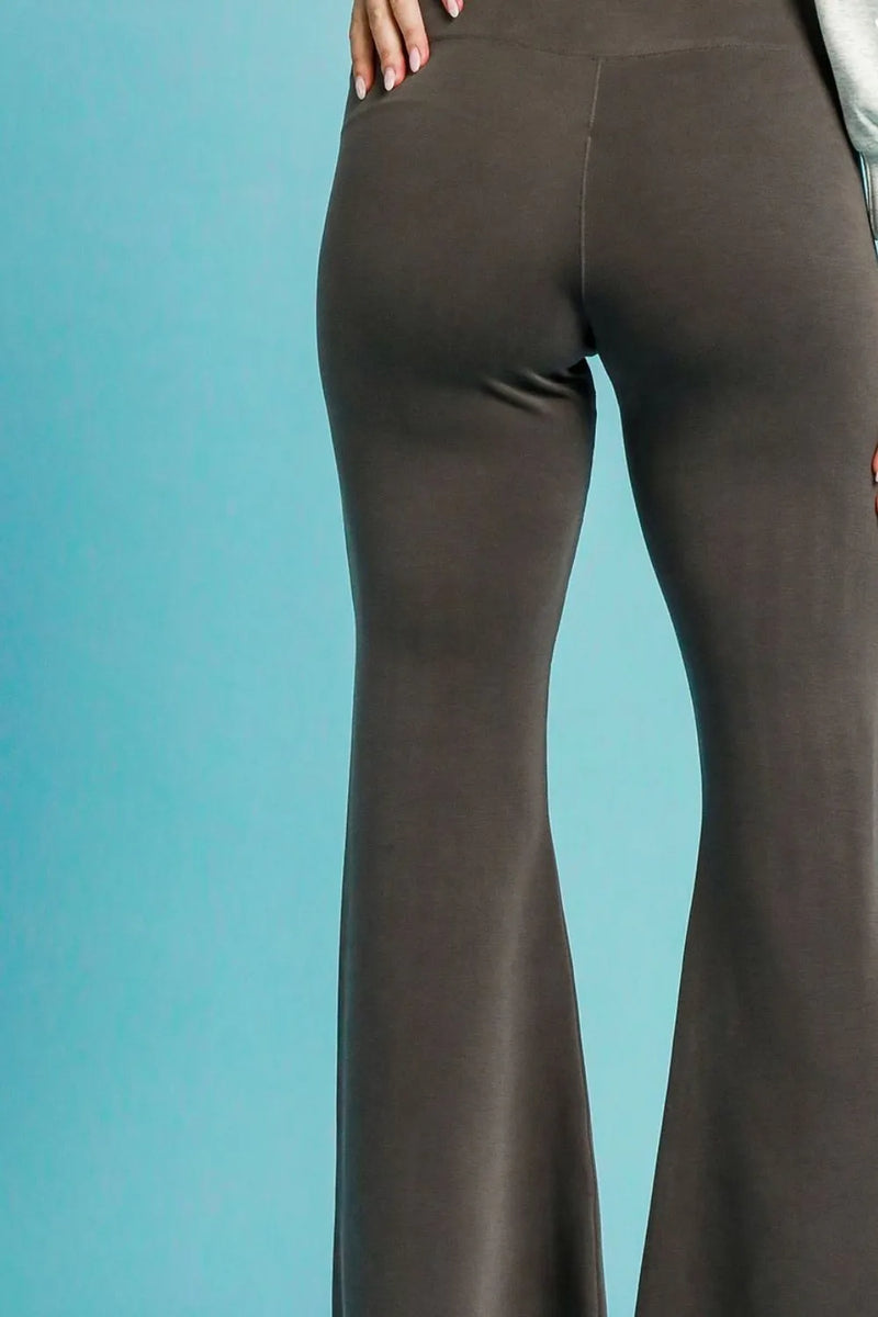 Brown flared pants on a blue background