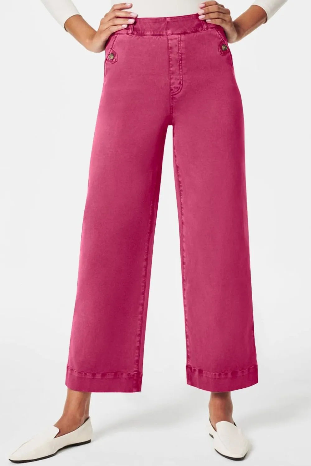 Pink wide-leg pants worn by a person on a white background