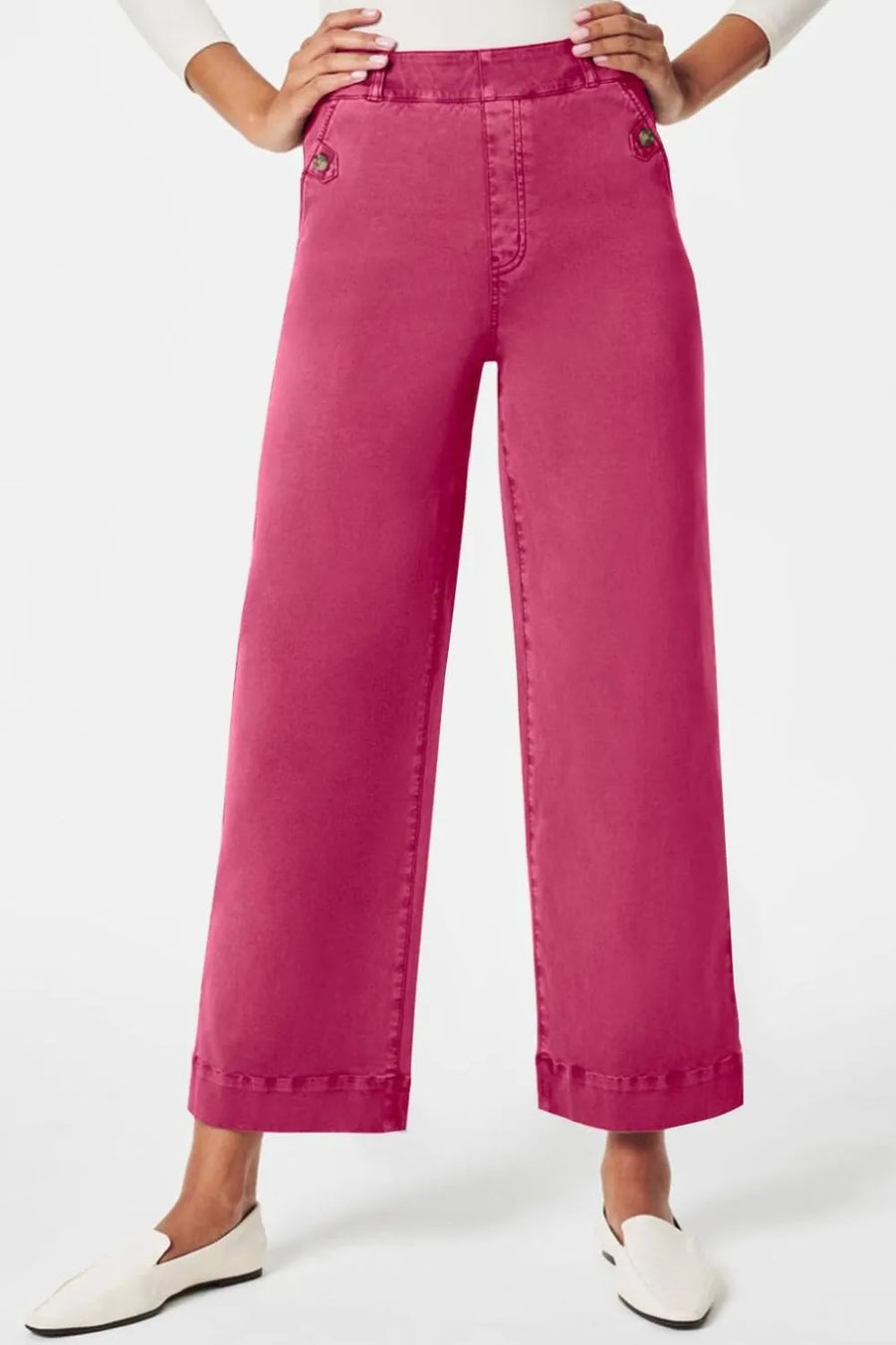 Pink wide-leg pants worn by a person on a white background