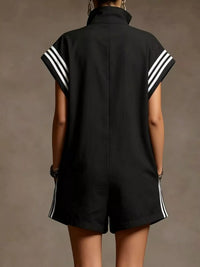 Black sleeveless top with white stripes on a plain background