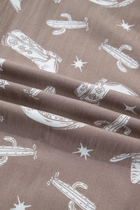 Brown fabric with white cactus and star pattern