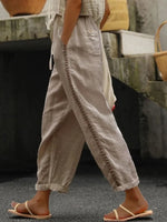 Person wearing beige pants with a blurred background