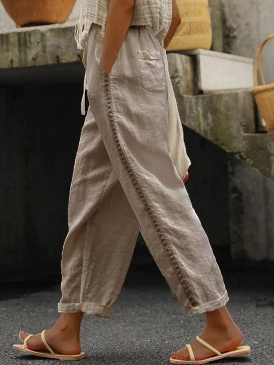 Person wearing beige pants with a blurred background
