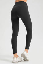 Black leggings worn by a person on a white background