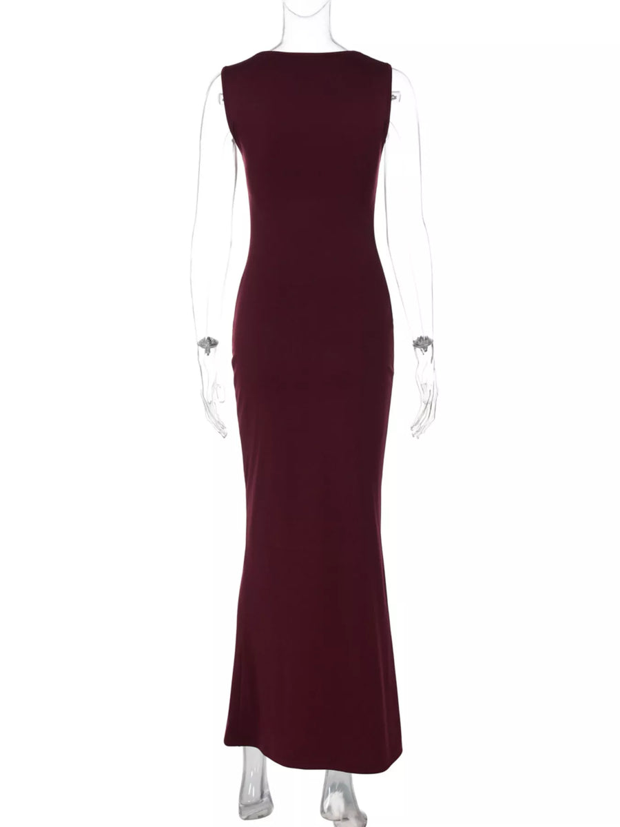 Maroon evening gown on a mannequin against a white background