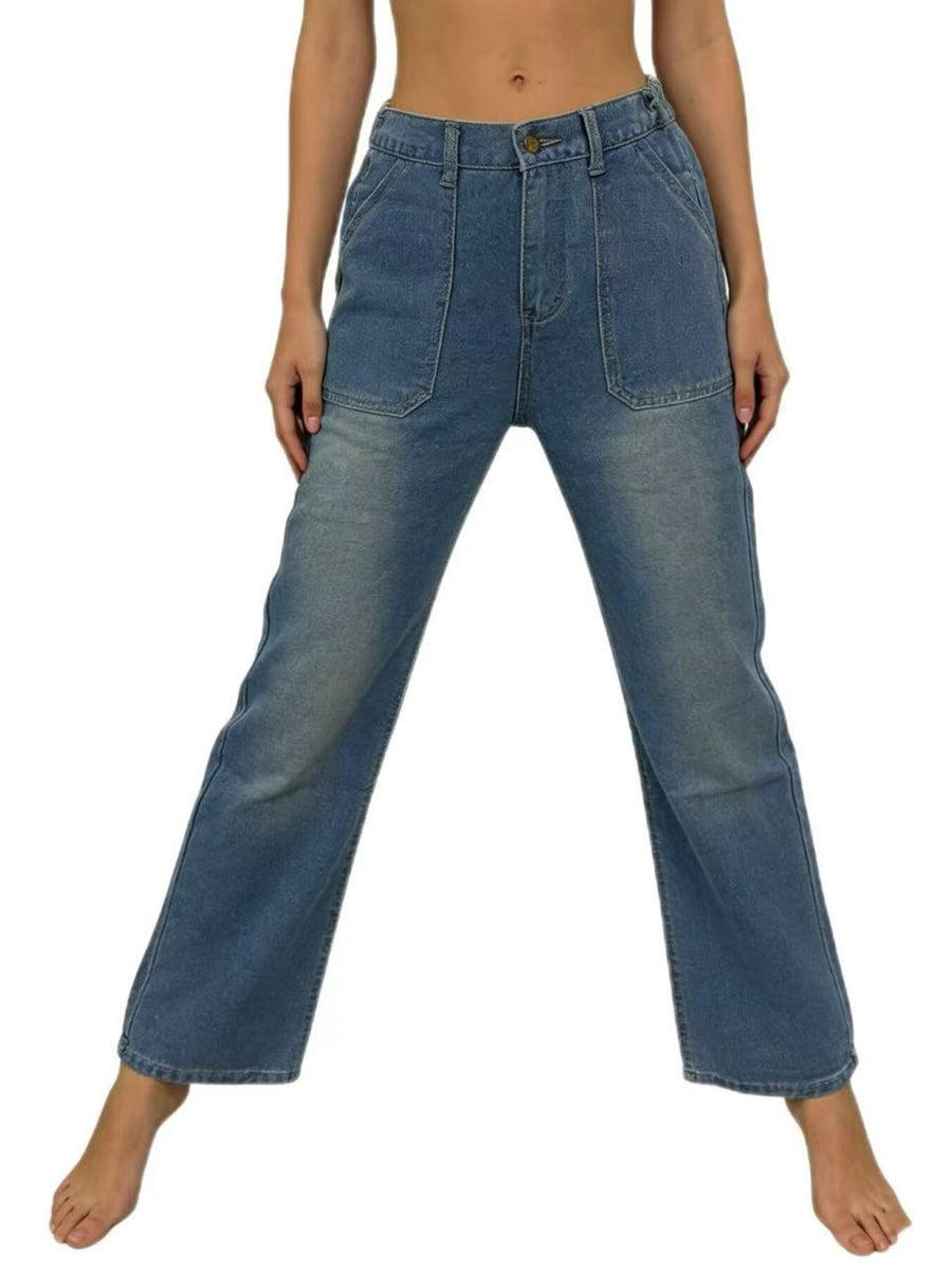 Blue jeans worn by a person on a white background