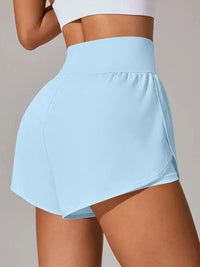 Light blue athletic skirt worn by a person on a neutral background