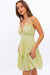 Side view of HALTER BABYDOLL TIERED MINI DRESS - PISTACHIO