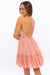 Back view of HALTER BABYDOLL TIERED MINI DRESS - apricot