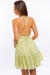 Back view of HALTER BABYDOLL TIERED MINI DRESS - PISTACHIO