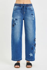 Blue jeans with star patterns on a white background