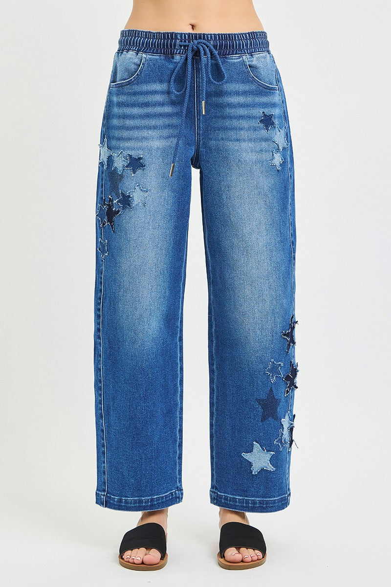 Blue jeans with star patterns on a white background