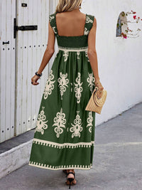 Woman wearing a green dress with white patterns, walking on a street.