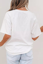 Person wearing a plain white t-shirt and light blue jeans against a neutral background