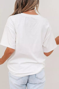 Person wearing a plain white t-shirt and light blue jeans against a neutral background