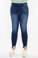 Person wearing blue jeans with a white background
