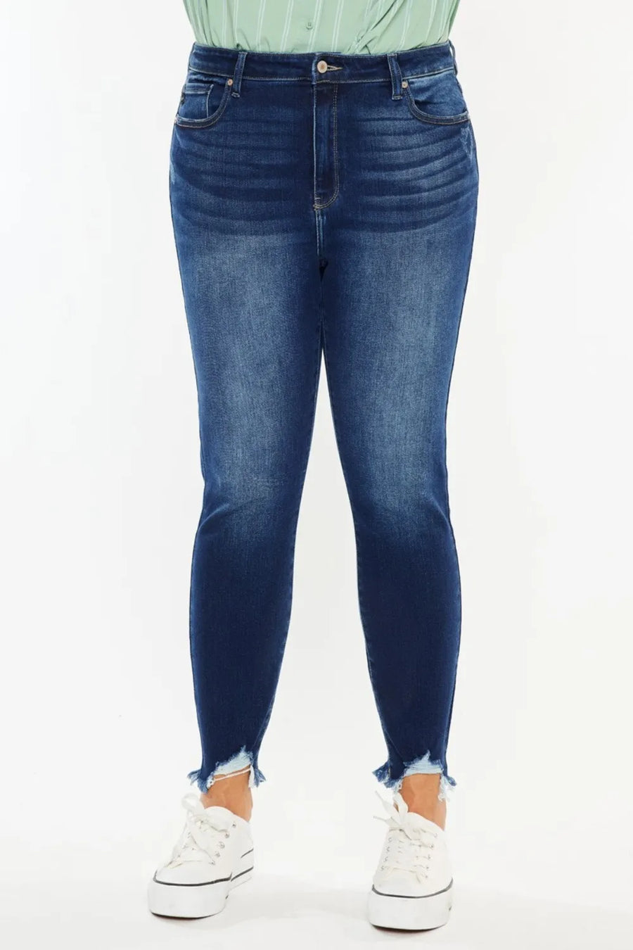 Person wearing blue jeans with a white background