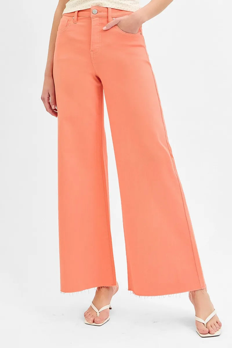 Coral wide-leg pants worn by a person on a white background