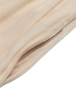 Close-up of beige fabric with a soft texture on a white background