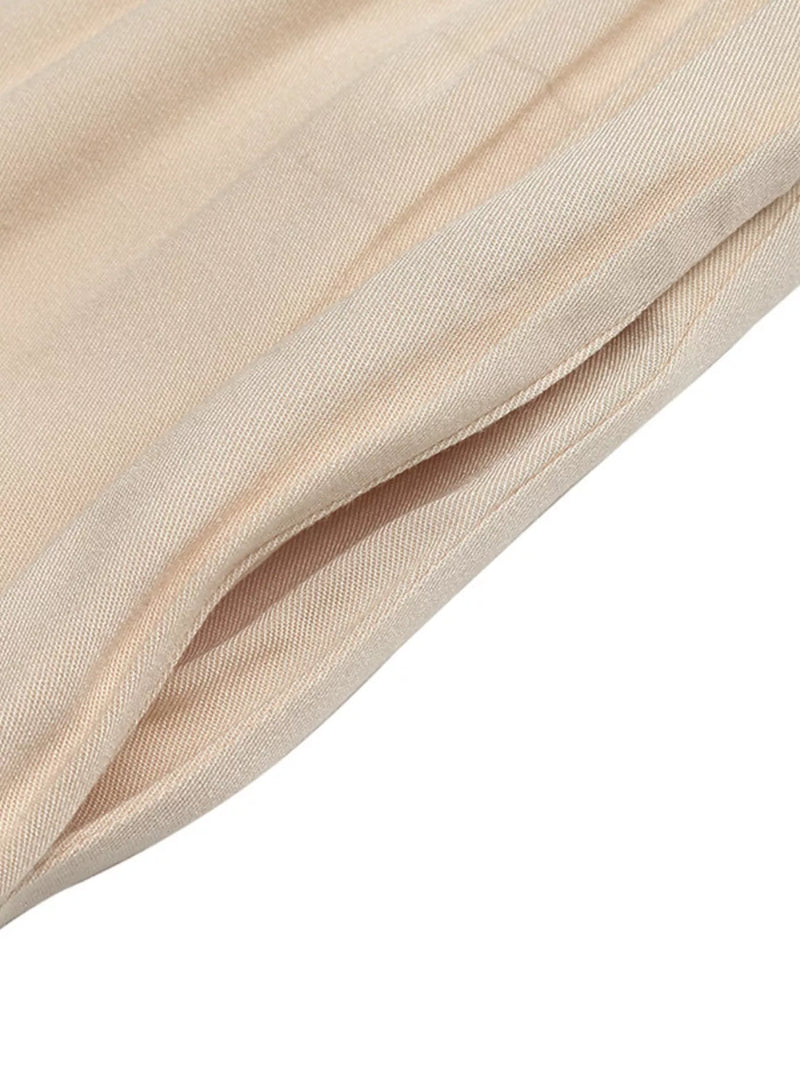 Close-up of beige fabric with a soft texture on a white background