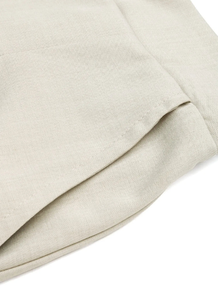 Close-up of beige fabric with a subtle texture on a white background