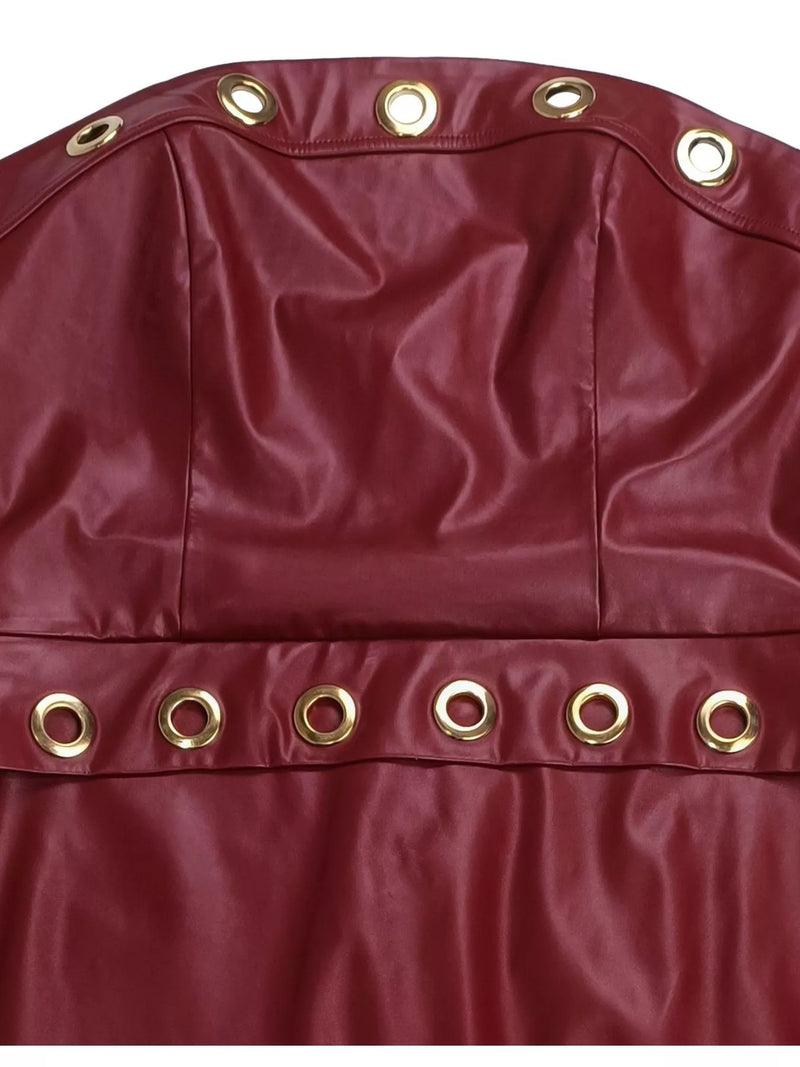 Close-up of a red bag with gold eyelets on a white background