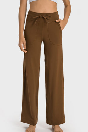 Brown wide-leg pants worn by a person on a white background