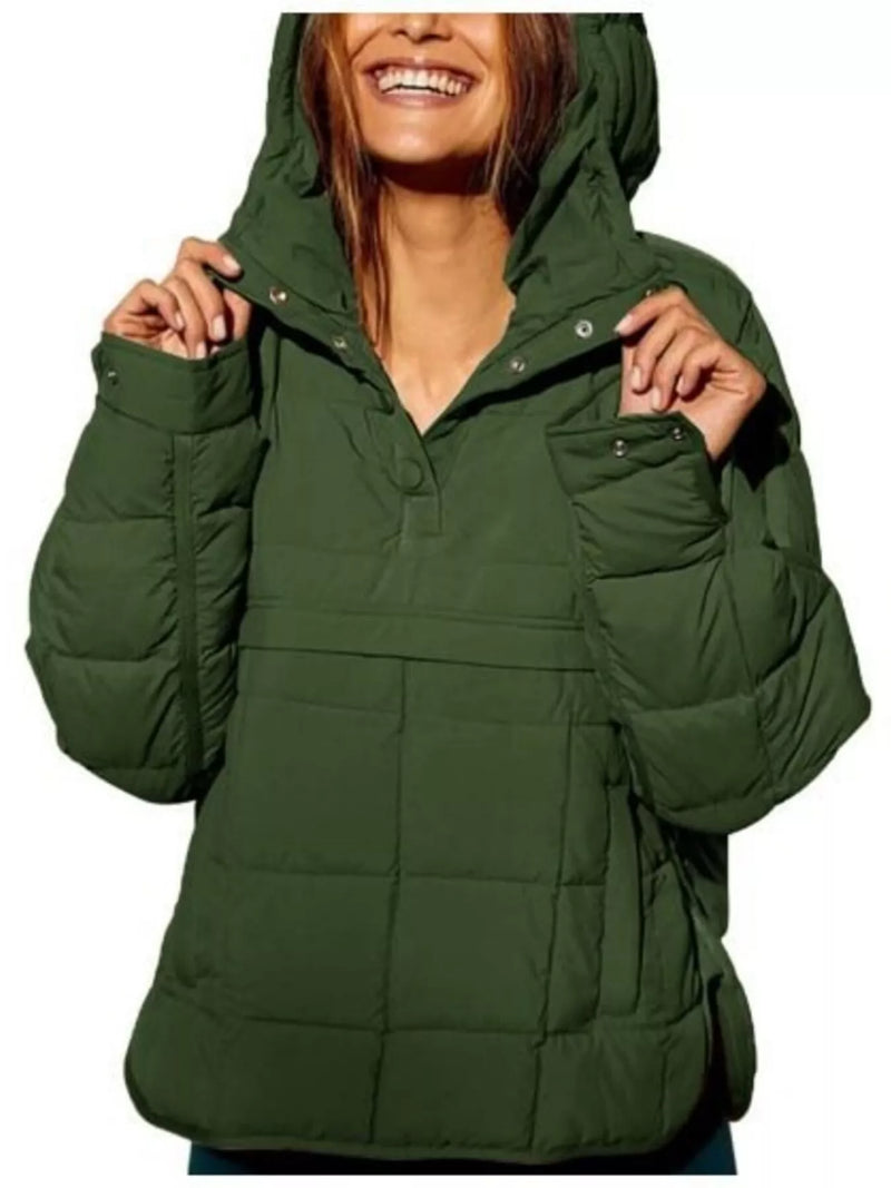 Green puffer jacket worn by a person on a white background