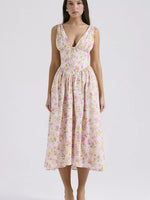 Woman wearing a floral dress on a white background