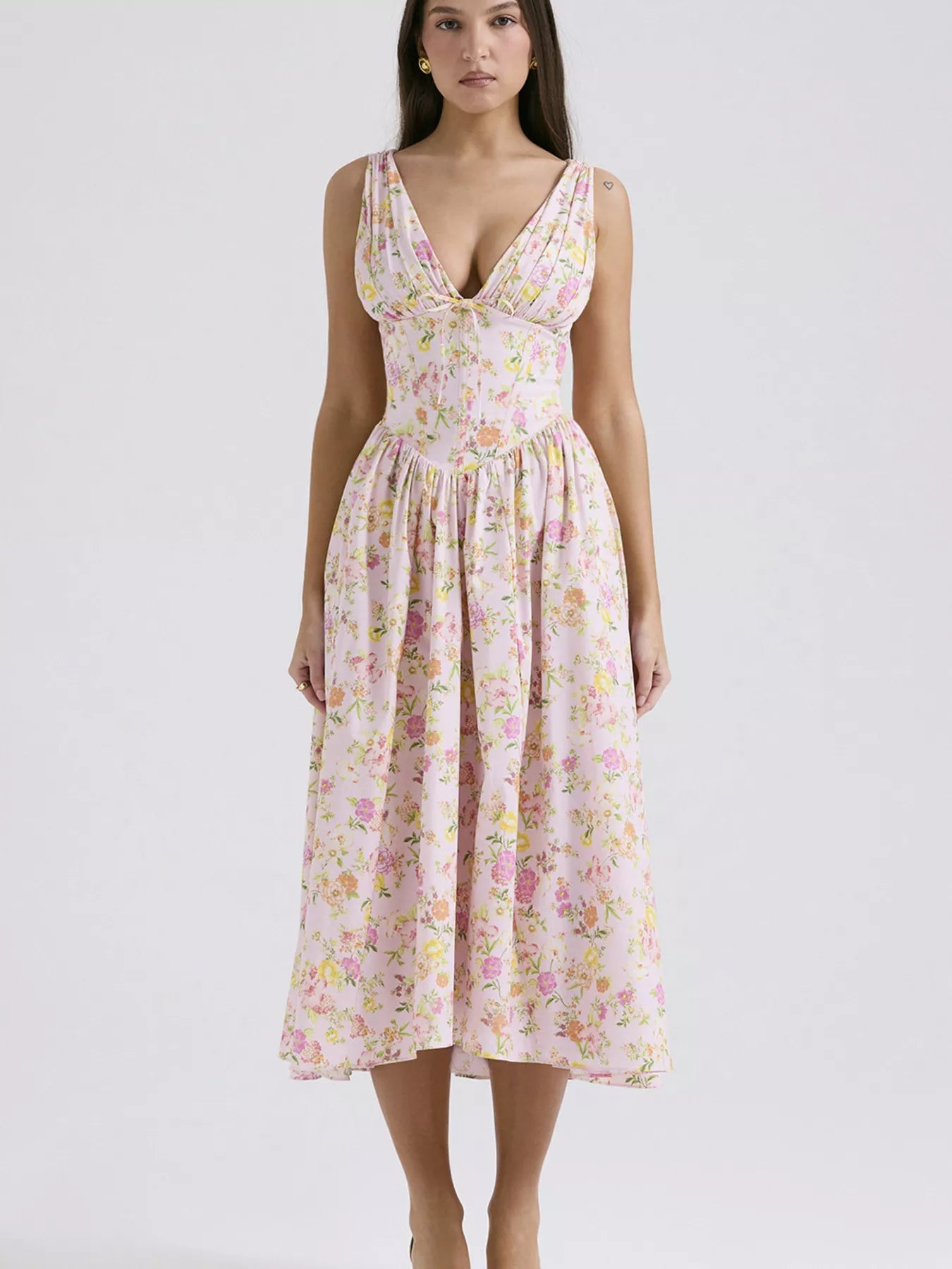 Woman wearing a floral dress on a white background