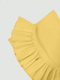 Yellow ruffled fabric on a light gray background