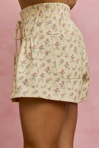Floral mini skirt on a pink background