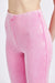 Close up view of the top half of HIGH WAIST RIB FLARED PANTS-pink