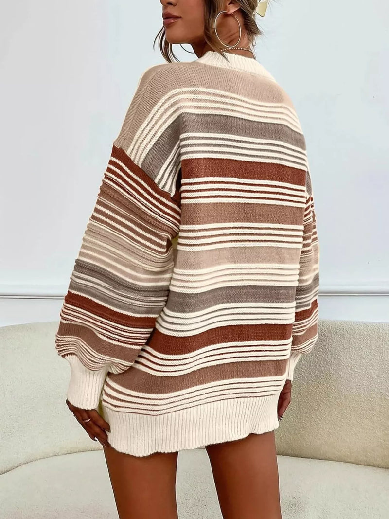 Person wearing a striped sweater with a neutral background