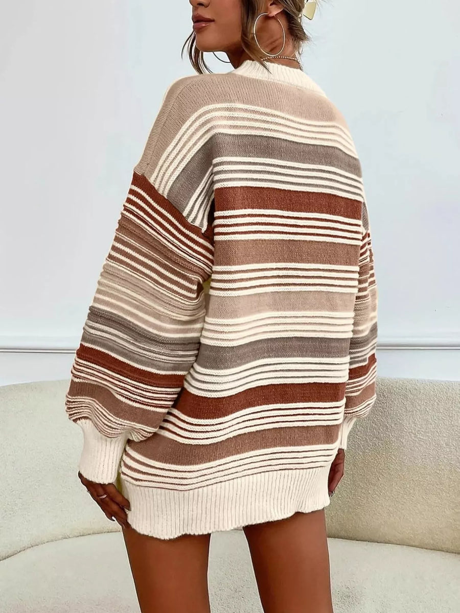 Person wearing a striped sweater with a neutral background