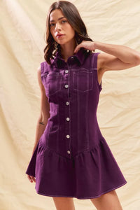 Woman wearing a purple dress against a beige background