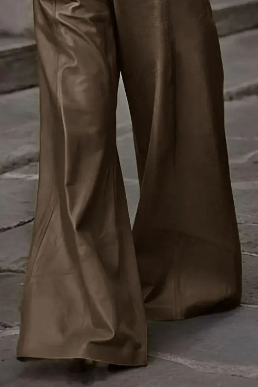 Brown wide-leg pants on a stone pavement