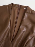 Brown leather jacket with a zipper on a white background