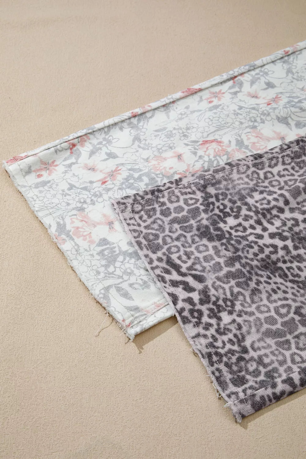 Two fabric swatches with floral and leopard print patterns on a beige background